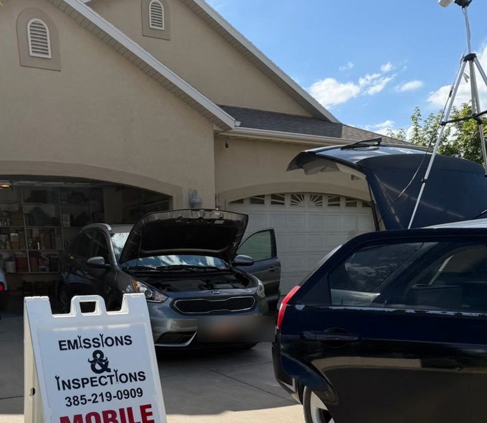 The Emissions & Inspections mobile sign set up outside a customer's home during an on-location test.